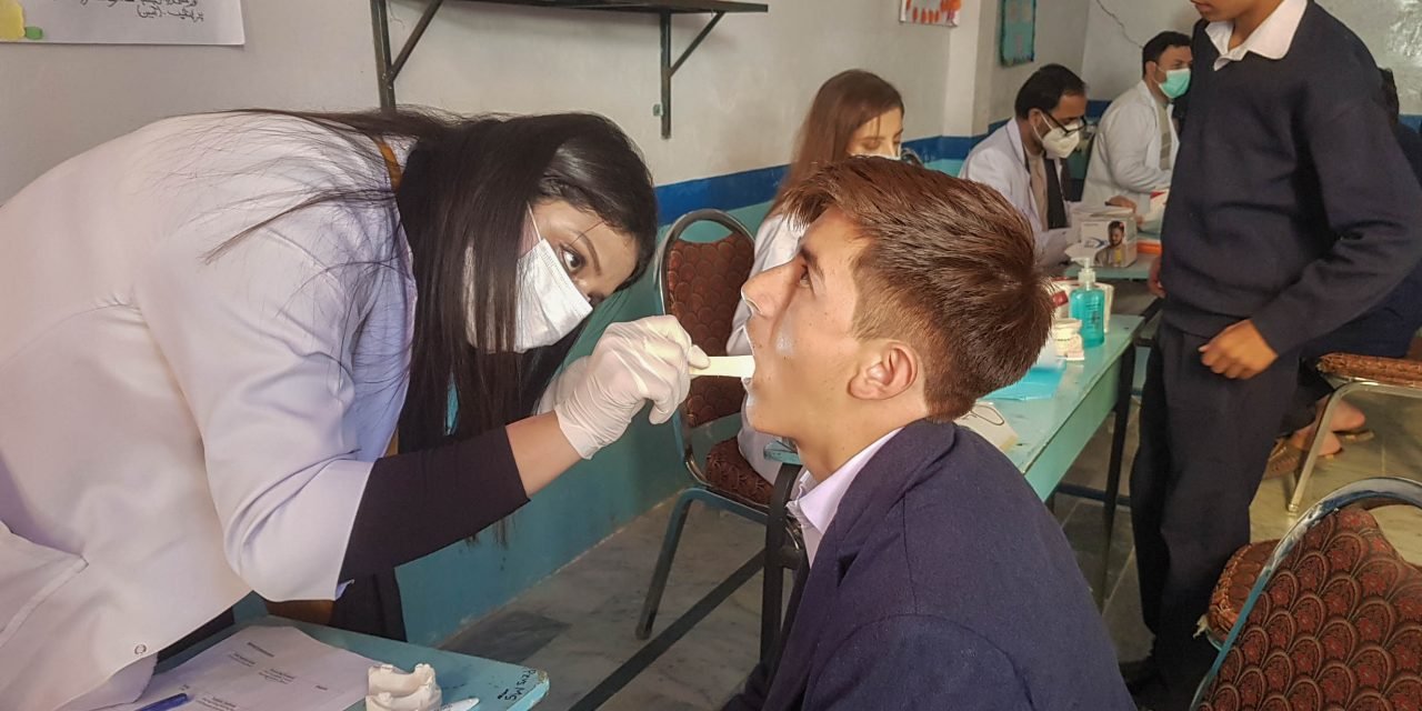 Young doctors and dentists provide volunteer services to orphans